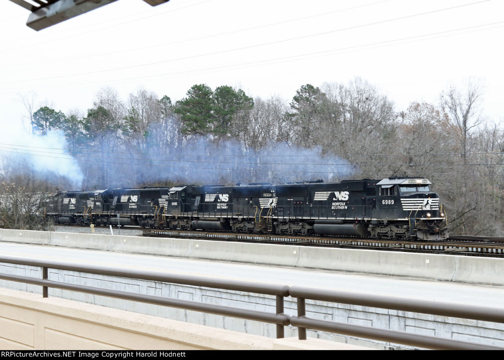 NS 6989 leads two other SD60E's and a GP38-2 across the Yadkin River bridge